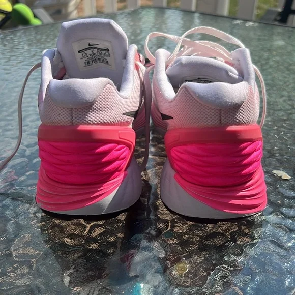 Nike Women's Pink, White and Black athletic sneakers. - Picture 9 of 17